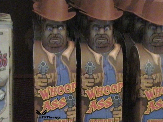 Cans of Whoopass on the shelf